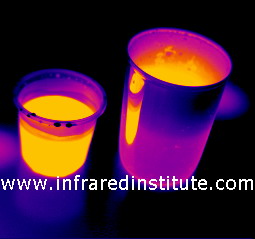 The effects of emissivity - two containers filled with fluid at the same temperature. One emits very effectively and the outside of the vessel displays the same energy level as the fluid. The other vessel emits a small proportion of its energy and appears to be cooler. As it is a metallic vessel with high thermal conductivity we know it will be the same temperature as the fluid.